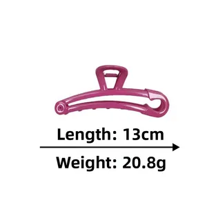 Detail view of pink safety pin hair claw clip showing 13cm length and 20.8g weight