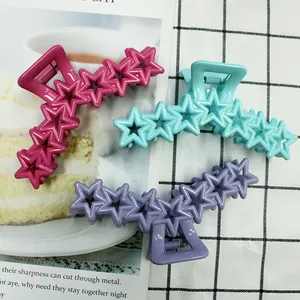 Three-piece star hair clips set in rose red, blue, and purple with hollow pentagon design