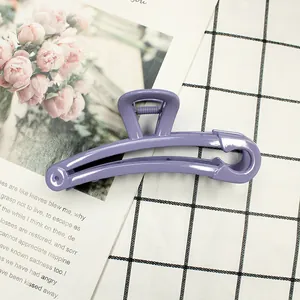 Detail of lavender safety pin hair claw clip with strong metal spring on desk