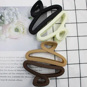 Set of four matte hollow claw clips in black, beige, coffee, and brown colors
