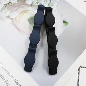 Detail of matte hair clips with unique triple alligator clips for layered styling