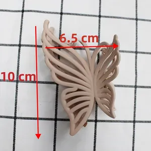 Detailed size view of 10cm matte butterfly hair claw clip in nude pink with cutout design