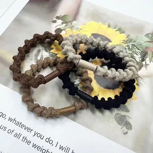 Set of four textured spiral hair ties in coffee, khaki, grey and black with metal joints