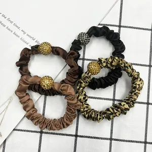 4-pack leopard print and solid satin scrunchies with rhinestone spheres set