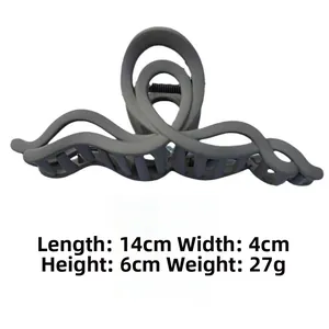 Detailed view of large matte grey shark hair claw clip with 14cm length and dimensions