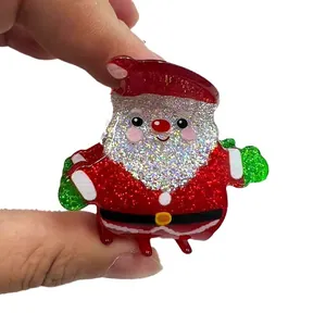 Glittering Santa Claus hair claw clip made of resin with red and silver sequins