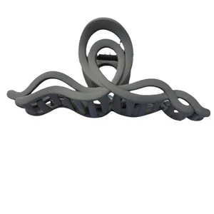 Matte grey large acrylic claw clip with wavy design for thick hair on white background