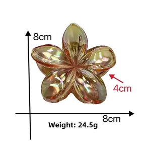 Detail view of 8cm iridescent plumeria hair clip with exact size and weight measurements