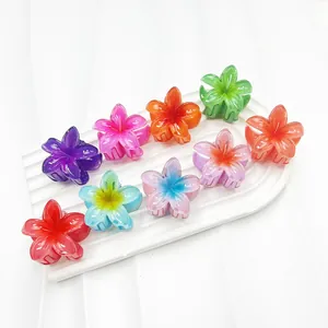 Dettaglio di fermagli per capelli a fiore da 4cm in resina in vari colori tropicali vivaci