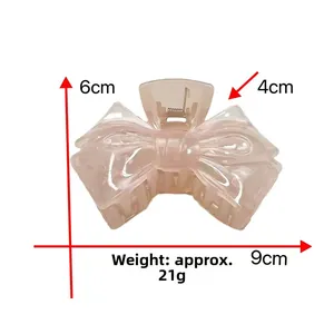 Detailed size specifications for the pink translucent bow-shaped shark hair clip accessory