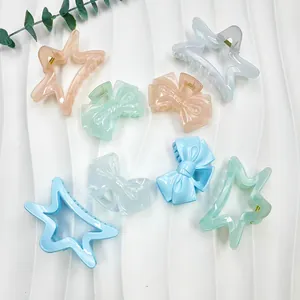 Macaron pastel star and bow hair claw clips set on a wavy white decorative background
