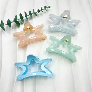 Set of four star-shaped shark hair clips in macaron pastel colors for women