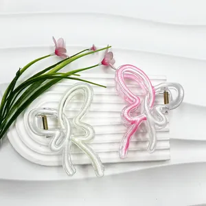 Colorful ribbon butterfly hair claw clips in pearlescent white and gradient pink finish