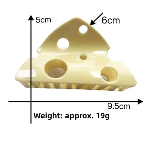Detailed view of yellow cheese shaped hair claw clip with specific size measurements