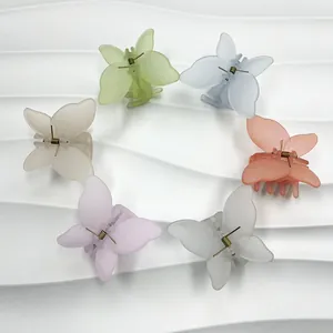 Lot de six pinces à cheveux papillon aux couleurs pastel mates sur fond ondulé élégant