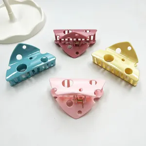 Cute cheese-shaped hollow hair claw clips in pastel yellow, blue, and pink colors