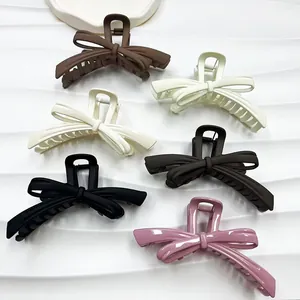 Set of large matte and glossy bow hair claws in six elegant neutral colors
