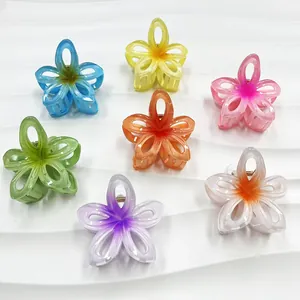 Set of seven gradient hollow plumeria flower hair claws in multiple pastel colors