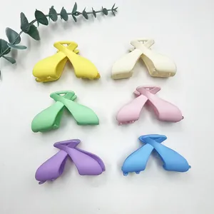 Matte candy-colored large bow hair claws in 6 macaron shades with a twist design