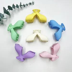 Set of six colorful matte candy-colored bow-shaped hair claw clips for women hair styling