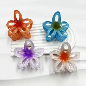Hollow gradient frangipani flower hair clips in four pastel colors with gold metal springs
