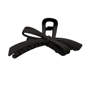 Minimalist matte black bow hair claw clip with strong metal spring for thick hair
