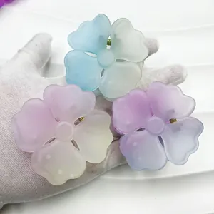 Close-up of matte gradient flower hair claws with durable metal spring mechanism