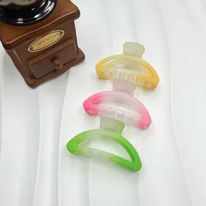 Three gradient candy-colored matte hair claws in yellow, pink and green tones