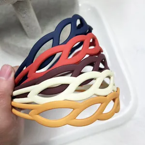 Matte wave cutout headbands set in navy, coral, burgundy, cream, and mustard yellow