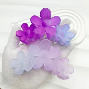 Detail of 11cm gradient flower hair claw clip in purple and blue pastel matte finish