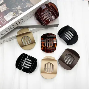 Set of seven large semi-round hair claws in various glossy and matte neutral finishes