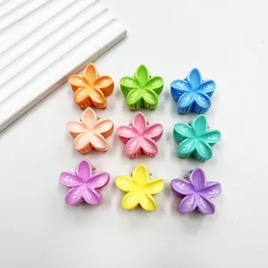 Set of nine colorful candy-colored flower hair clips in a organized 3x3 grid layout