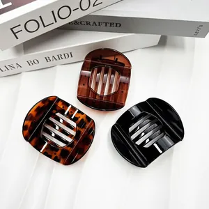Three-piece set of flat rectangular hair claws in tortoiseshell, brown, and black colors