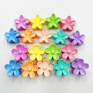 Macro view of 3cm colorful candy-colored mini plumeria flower hair clips for children