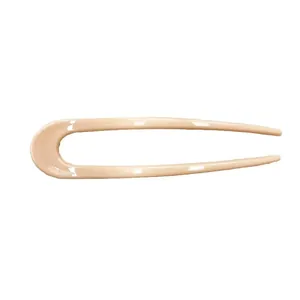 Elegant U-shaped hair fork in glossy nude pink resin for minimalist hairstyling