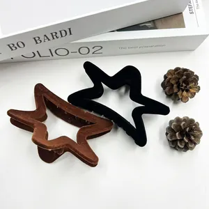 Elegant flocked star hair claws in black and brown finish with velvet texture for women
