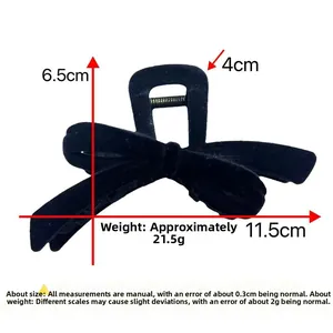 Detailed dimensions of 11.5cm black flocked bow hair claw clip with size annotations