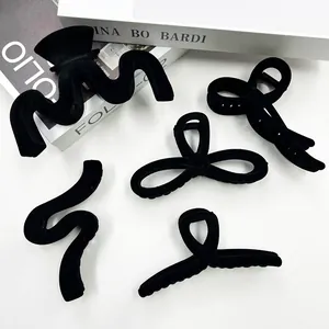 Five-piece set of elegant matte black flocked hair claws in various vintage shapes