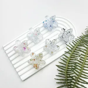 Set di sei mini mollette per capelli a forma di fiore in resina con pois colorati