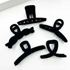 Detailed set of 5 black matte flocked hair claw clips in various geometric shapes
