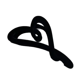 Elegant black flocked heart-shaped hair claw clip with a minimalist velvet texture finish