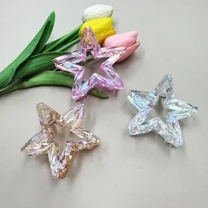 Close-up of three iridescent star-shaped hair claws with wavy texture and tulip decor