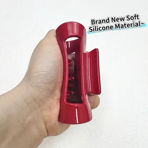 Glossy red soft silicone shark hair claw clip for thick hair held in hand, 2025 style