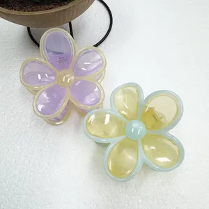 Detail of jelly flower hair clips with purple and yellow petals and spring closure