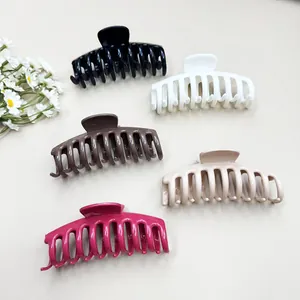 Set of five large soft silicone shark hair clips in black, white, coffee, beige, and rose