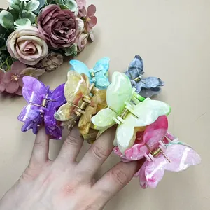 Double-layered marble texture butterfly hair claws in multiple pastel colors