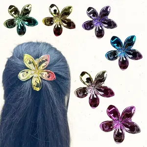 Detailed view of plumeria hair clips with vibrant metallic gradient plating finishes