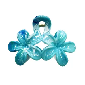 Pince à cheveux fleur de frangipanier marbré bleu et blanc pour coiffure de vacances