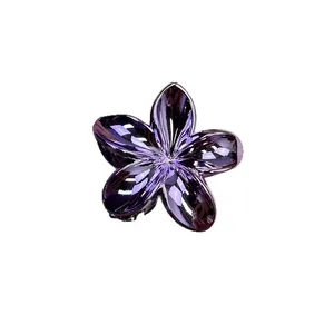 Glossy purple frangipani flower hair claw clip made of translucent resin for women