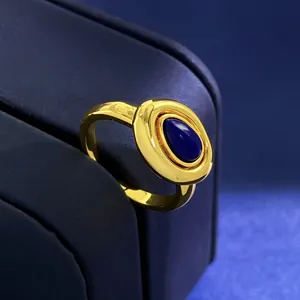 Close-up of vintage gold ring featuring a deep blue oval lapis lazuli gemstone inlay